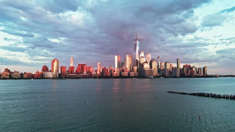 New York skyline with dramatic lighting. New York skyline in evening light Stock Footage 345543044