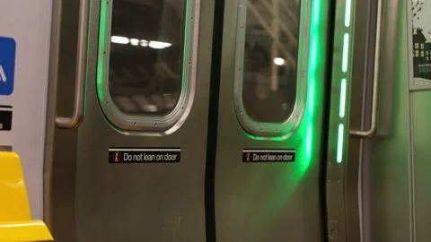 New York Subway Train Doors, Moving Train, Do Not Lean on Door Sign, Cinematic 스톡 동영상 335960787