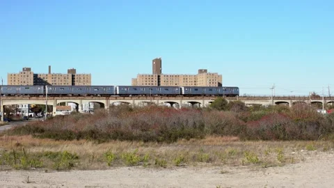 New York Subway Train on Elevated Track near Beach at Far Rockaway. Stock Footage 147003834