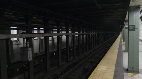 New York Subway Train Pulls Into Nearly Empty Station During COVID19 Pandemic 4K Stock Footage 133744176
