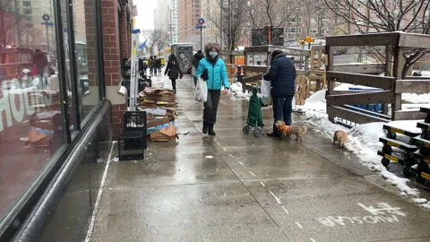 New Yorkers navigate slippery sidewalks during a snowy day in New York City 스톡 동영상 150815662