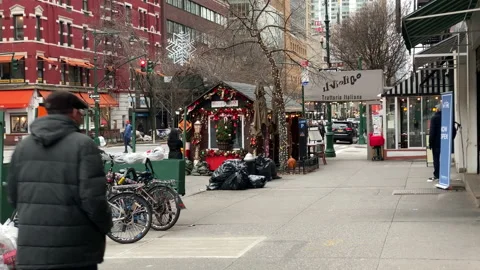 New Yorkers pass by a tiny sidewalk curbside pop-up Christmas shop Stock Footage 147294207