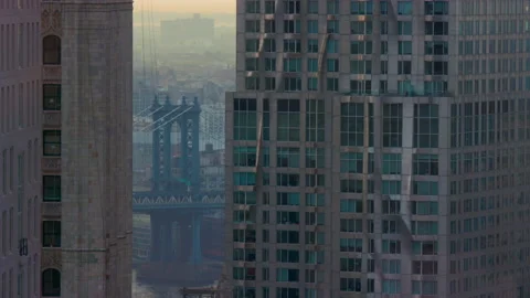 New York's Manhattan Bridge beyond some skyscrapers Stock Footage 161920854