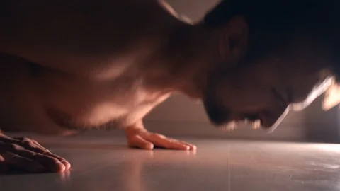 Newbie doing push-ups with tense face Stock Footage 121323695