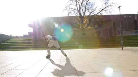 Newbie inline skater barely standing on rollerblades for first time Stock Footage 119476499