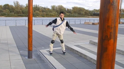 Newbie inline skater jumps while barely standing on skates Stock-Footage 120445631