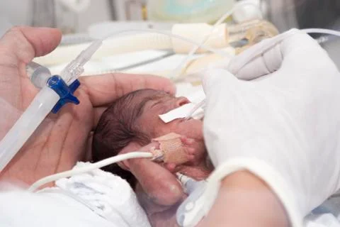 Newborn and hand Stock Photos