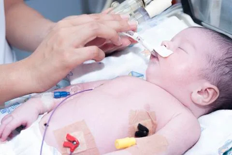 Newborn and hand Stock Photos