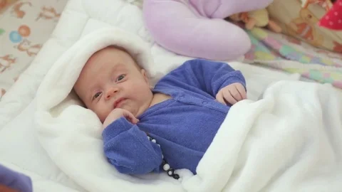 The newborn is awake in the crib Stock Footage 80001614