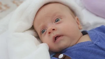 The newborn is awake in the crib Stock Footage 85637355