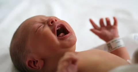 Newborn baby boy crying at hospital after birth Stock Footage