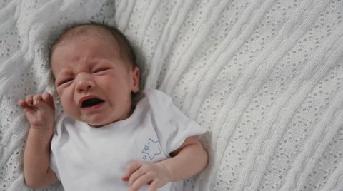 Newborn baby crying in bed 스톡 동영상 49461444
