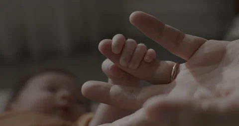 Newborn Baby Holding Father's Finger Stock Footage