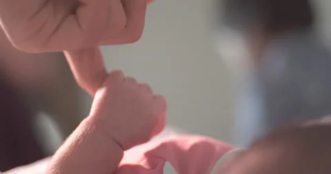 Newborn baby holding mother's hand Stock Footage