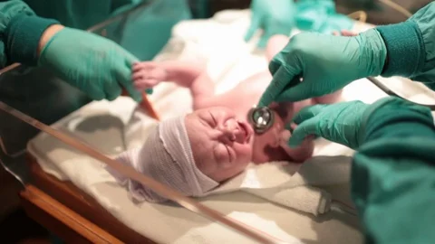 Newborn Baby in Hospital Moments After Being Born Stock Footage