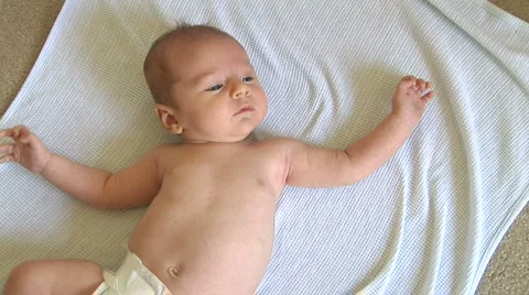 Newborn baby laying on blanket Stock Footage