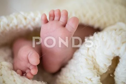 Newborn baby small feet Stock Photos