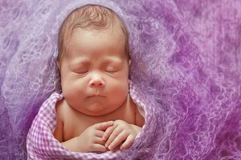 Newborn baby tender sleeping on wool couturier blanket. Pure human value love Stock Photos