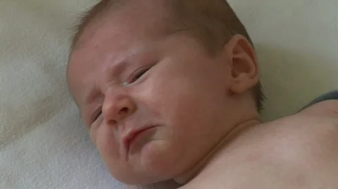 Newborn baby unhappy and crying Stock Footage