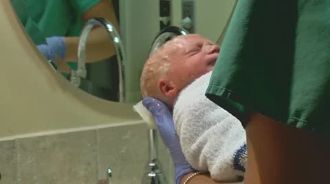 Newborn baby's first bath 03 Stock Footage