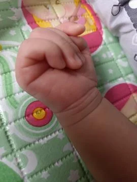 Newborn baby's hand. Close-up view Stock Photos