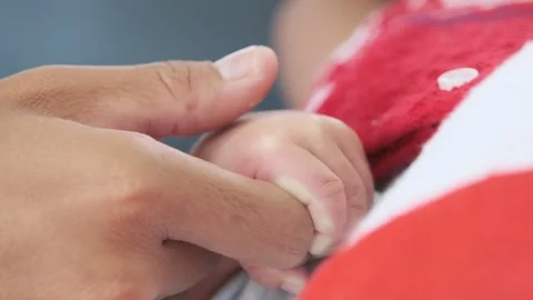 https://images.pond5.com/newborn-babys-hand-holds-her-footage-242740908_iconl.jpeg