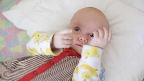 Newborn in bed Stock Footage 81023248