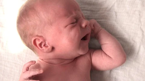 Newborn beginning to cry Stock Footage 94224936