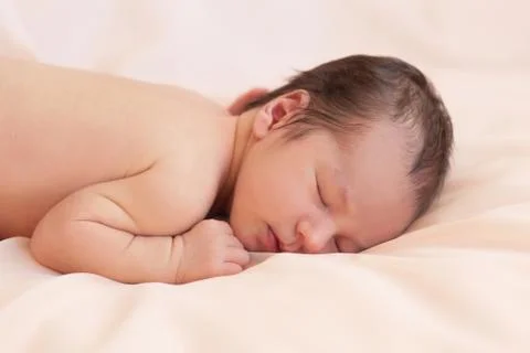 Newborn  on beige background Stock Photos