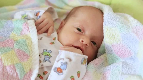 Newborn boy in the crib Stock Footage 98130926