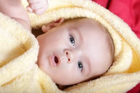 Newborn - close-up focus baby boy with yelow blanket Stock Photos