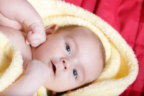 Newborn - close-up focus baby boy with yelow blanket Stock Photos