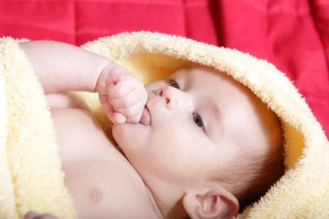 Newborn - close-up focus baby boy with yelow blanket Stock Photos