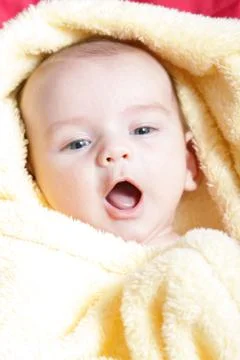 Newborn - close-up focus baby boy with yelow blanket Stock Photos