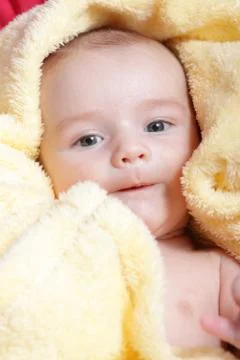 Newborn - close-up focus baby boy with yelow blanket Stock Photos