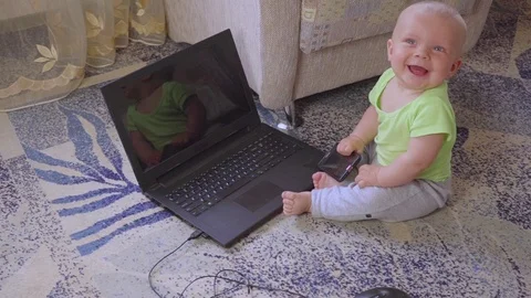 A newborn with a computer Video stock 76326334