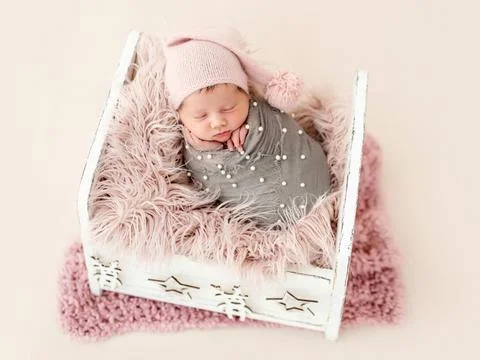 Newborn in cradle Stock Photos