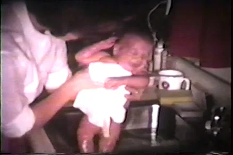 Newborn cries in sink while being bathed, 1967 Video stock 36094057