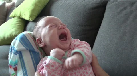 Newborn crying on mom legs Stock Footage 44137338