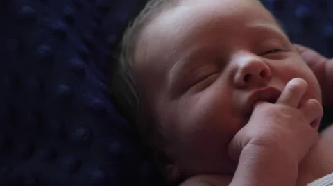 Newborn infant self soothing Stock Footage 59123093