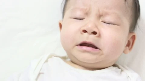 Newborn sleeping and playing on the bed Stock Footage 104686365