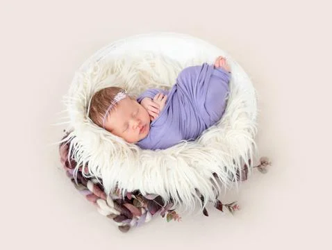Newborn sleeping in cradle Stock Photos