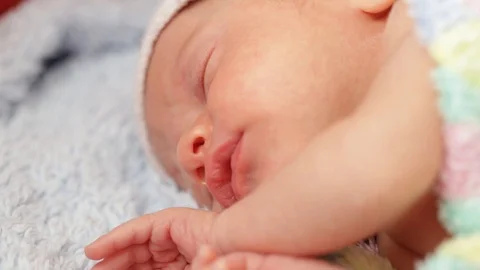 Newborn sleeping in crib close-up Stock-Footage 106196664