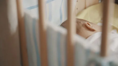 Newborn sleeping in his crib Stock Footage 54366744