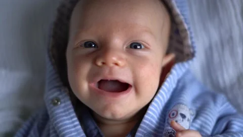 Newborn smiling looking in to camera Stock Footage 166363745
