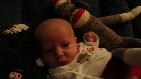 Newborn by Sock Monkey at Christmas Stock Footage 10592072