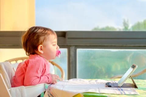 Newborn tablet tv digital native Stock Photos