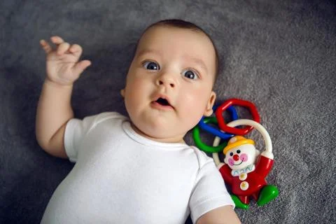 Newborn to three months lying in bed Stock-Fotos