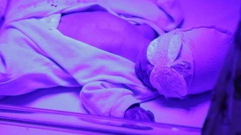 Newborn under the lamp Stock Footage 98134931