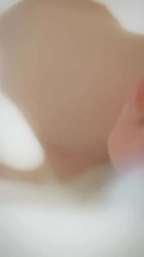 Newborns legs bask in sunlight capturing innocence on a bright day Stock Footage 331667936